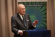 Retired Supreme Court Justice Anthony Kennedy speaking at a lectern